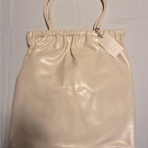 a new day Cream Drawstring Tote Bag